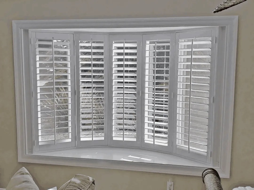 Custom bay window shutters installed in an Oceanside home