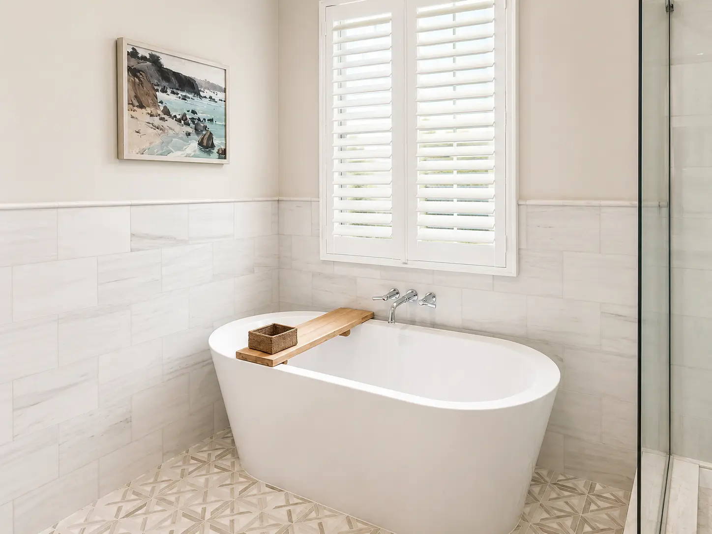 White poly shutters above a freestanding tub in a master bath