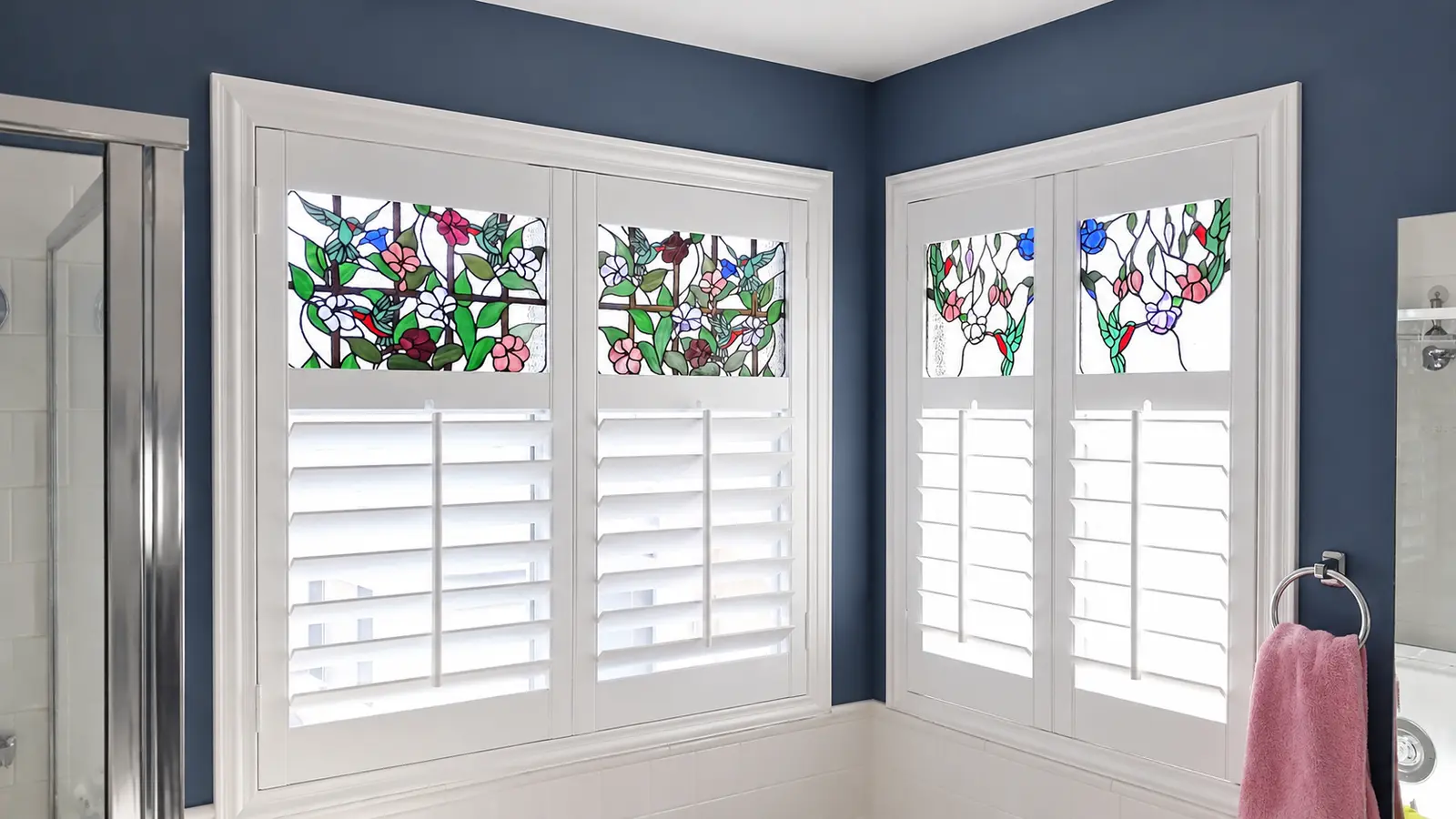 White plantation shutters preserving stained-glass transom panels
